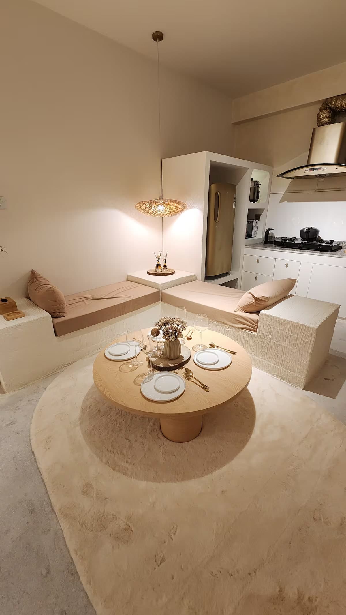 Lagom lounge seen from above, with a woven pendant light and a set table
