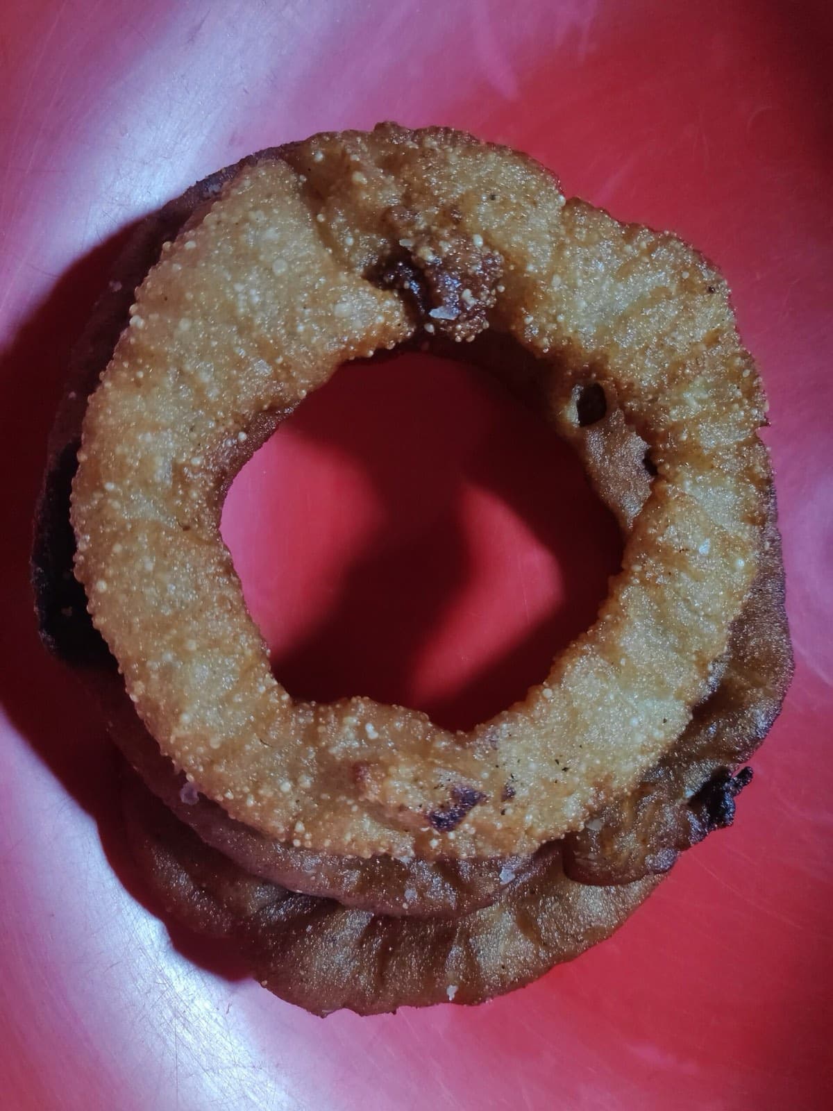 Sel roti, crisp ring-shaped rice bread fried golden for the festivals